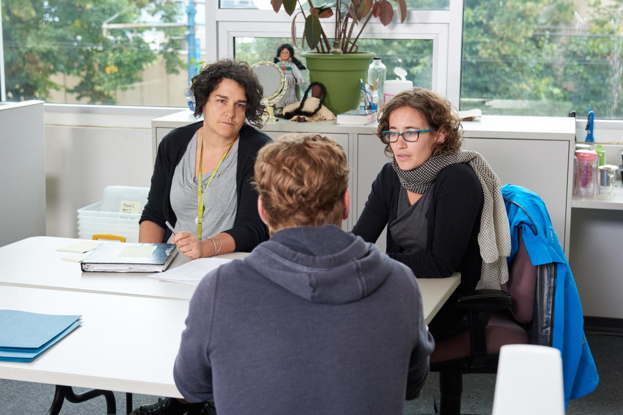 Health care professionals talking to a client