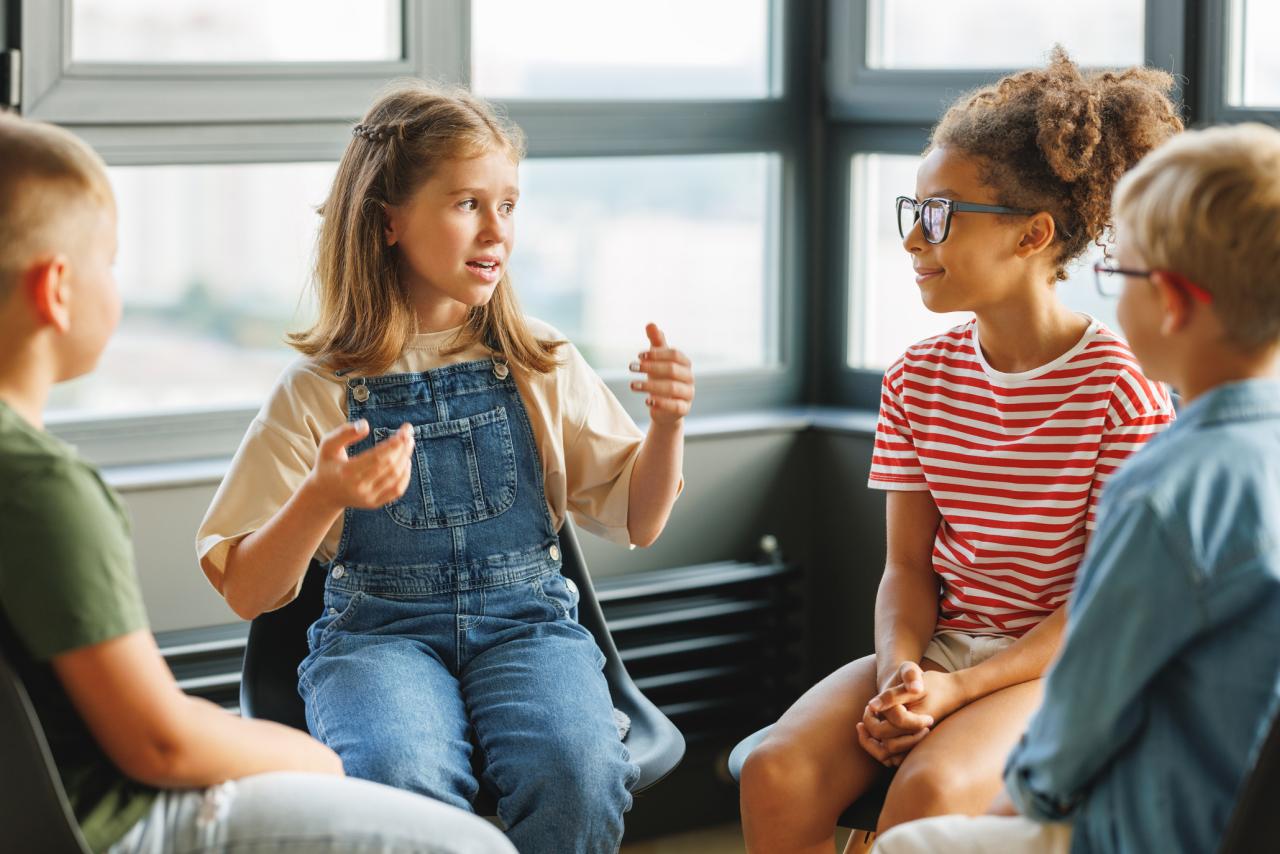 A group of children talking in a circle