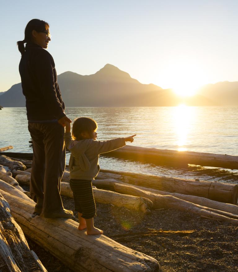 Mother and child looking at the ocean
