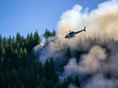 Forest fire, helicopter responding. 