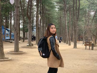brown haired women with black backpack