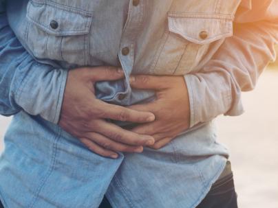 man holding stomach
