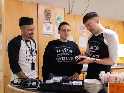 Team at Insite in Vancouver looks at naloxone kit.