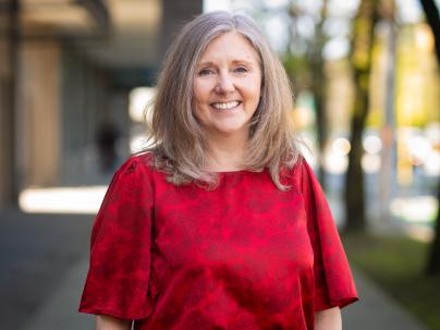 Bonnie Wilson from Vancouver Coastal Health standing and smiling.